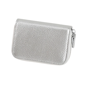 Detail view of silver lychee texture leather card holder with secure metal zipper closure