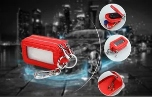 Red pebbled leather car key case featuring double zippers and a transparent window
