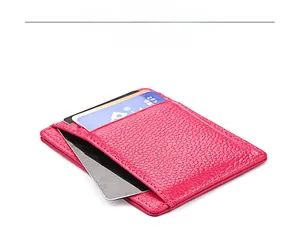 Detail view of pink lychee leather card holder with multiple credit card slots
