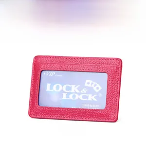 Macro view of rose pink lychee leather card holder with clear ID window slot