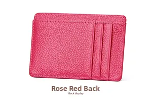 Macro view of rose red leather card holder back showing fine stitching and RFID slots