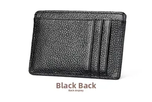 Detail view of the black pebble leather wallet back showing three precise card slots
