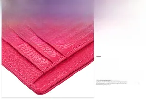 Close-up of rose red litchi texture leather card holder with fine precision stitching