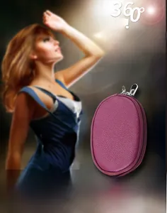 Detailed view of a purple pebble grain leather mini coin purse with silver zipper and ring
