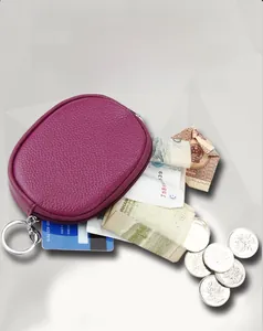 Purple leather mini coin purse with three inner compartments showing storage detail