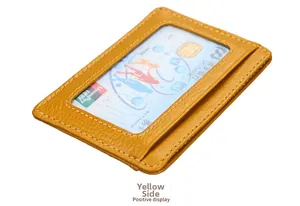 Detail view of yellow leather RFID card holder with transparent ID window and stitching