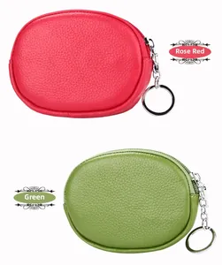 Detail of genuine leather mini coin purses in rose red and green with litchi texture