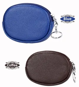 Detail view of lychee texture leather coin purses in blue and brown with silver zippers