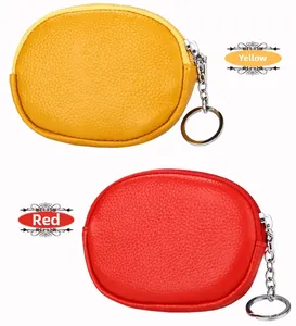 Detail view of yellow and red pebbled leather mini coin purses with keychains