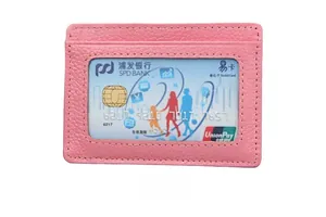 Detailed close-up of pink RFID leather card holder with clear window and stitching