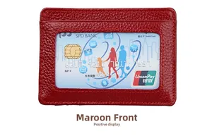 Close-up of jujube red leather card holder with RFID window and pebble grain texture