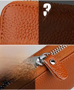 Detail of brown genuine leather card holder featuring fine stitching and smooth metal zipper