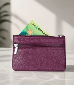 Detail of purple genuine leather RFID blocking coin purse with silver metal zippers