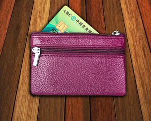 Detailed view of purple leather wallet with dual silver zippers and RFID card slot