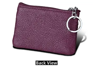 Back view of a mini purple pebble leather coin purse with RFID blocking and a silver keychain