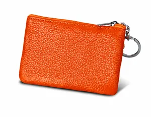Close-up of orange lychee grain leather wallet with RFID protection and silver key ring
