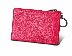 Side view of rose red pebble leather coin purse with metal zipper and key ring attachment