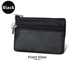 Front view of black pebble grain leather mini coin purse with double silver zippers and keychain