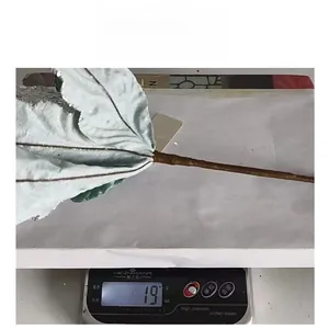 Détail d'une fleur de Noël artificielle de 19g avec paillettes argentées et bleu