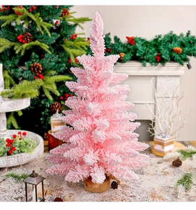 Pink flocked mini Christmas tree with burlap base and snowy texture for tabletop decor