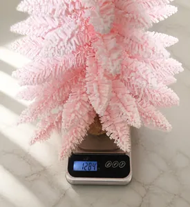 Pink flocked Christmas tree decoration with burlap base weighing approximately 128.4g