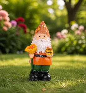 Detail of garden gnome with sunflower hat holding a honey pot and blossom
