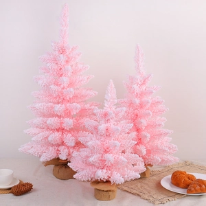 Pink flocked Christmas tree set with snow effect and burlap base for holiday decor