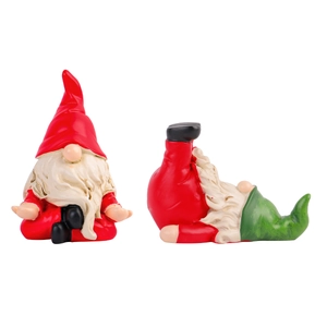 Set of two Christmas yoga gnomes in red and green hats for home holiday tabletop decor