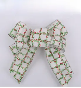 Detailed view of red and green plaid Christmas bow with silver metallic wired edges