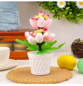 Detail of Easter egg potted plant with speckled eggs, yellow flowers and woven texture pot