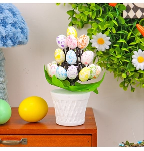 Detail of Easter egg tree with colorful speckled eggs in a white woven texture pot
