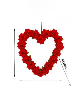 Macro detail of artificial red rose heart wreath with dimension markings and hanging rope