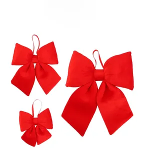 Three-piece set of red velvet decorative bows in small, medium and large sizes