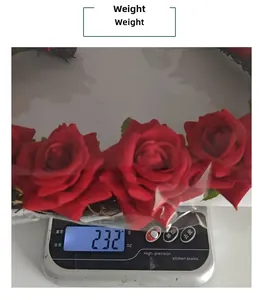 Detail view showing red rose wreath weight 232g on a digital scale for quality assurance