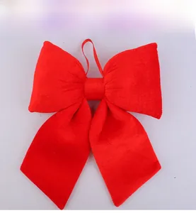 Detail of red velvet decorative bow featuring high-quality fabric and hanging loop