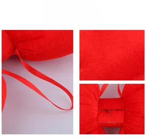Detail of large red velvet New Year bow showing texture and satin ribbon craft