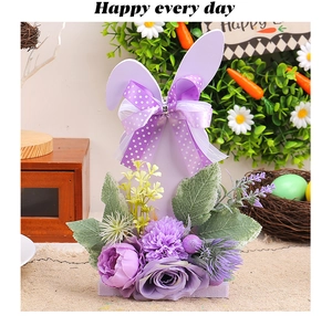 Detail of purple Easter bunny centerpiece with silk peonies, roses and ribbons