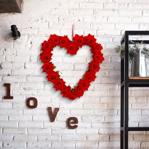 Romantic heart-shaped red rose wreath for Valentine's Day decor with a red hanging string