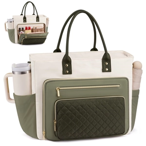 Detail view of the multi-pocket tote bag with olive green pockets and cream nylon fabric