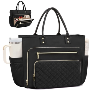 Quilted black nylon laptop tote bag with gold hardware and side storage pockets
