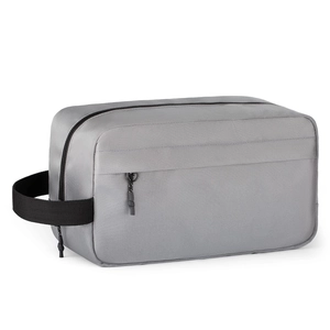 Close-up of grey toiletry bag with durable texture and black woven carry handle