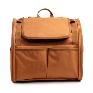 Detailed side view of a brown canvas pet carrier with breathable mesh and large pockets