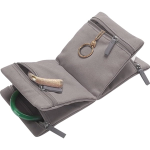 Detailed interior of a grey microfiber jewelry organizer roll with zippered pockets