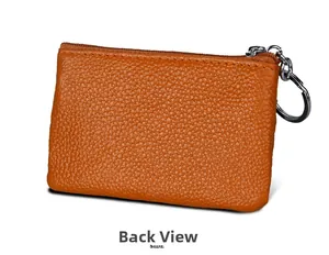 Back view of orange genuine leather mini coin purse with RFID protection and key ring