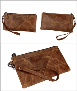 Detail view of vintage crazy horse leather RFID wallet with wrist strap and metal zipper