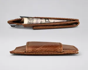 Detail view of the brown leather slim wallet thickness with cash and card slots