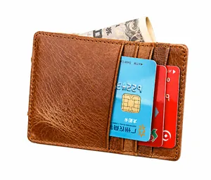 Macro detail of crazy horse leather wallet showing card slots and sturdy stitching