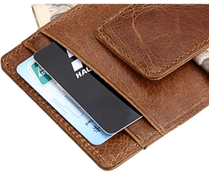 Macro detail of crazy horse leather wallet showing card slots and premium stitching