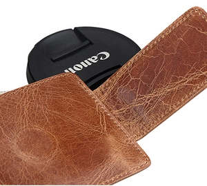 Detailed view of vintage brown crazy horse leather wallet with durable hand-stitched edges