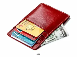 Slim red leather card holder wallet showing side slots and bank cards in high detail